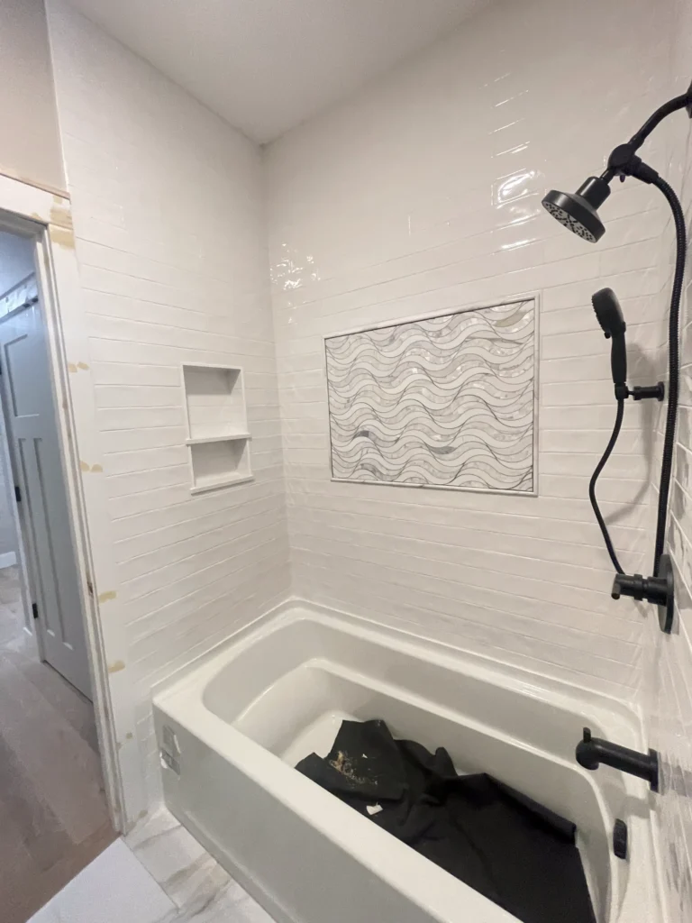 Open kitchen with white cabinets and modern hardware