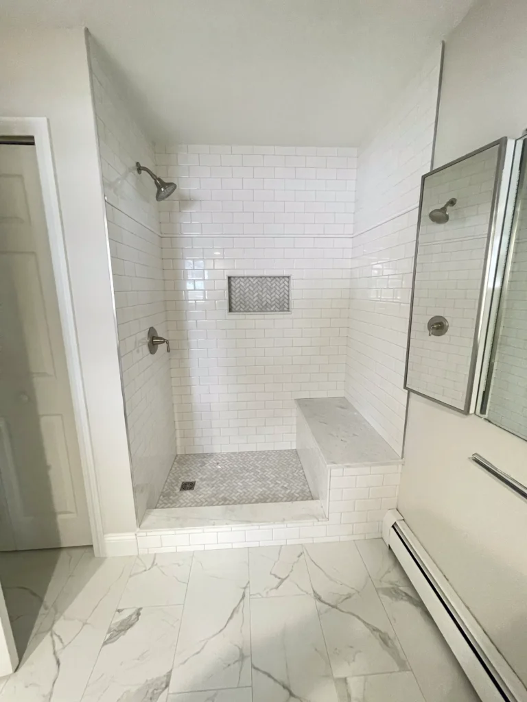 Bathroom renovation with new tile and fixtures