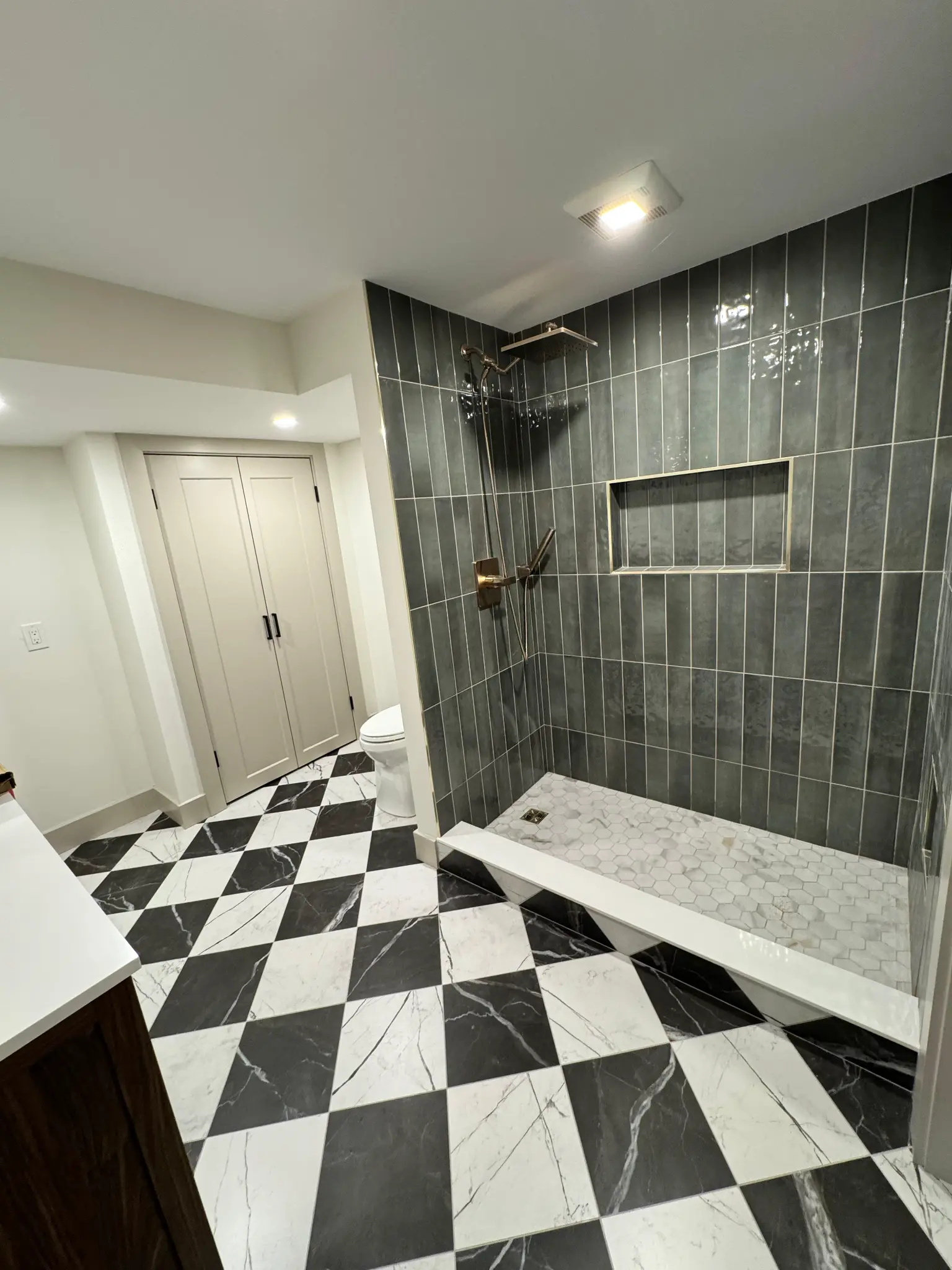 Bathroom vanity and tile remodel by Regulus Construction in MetroWest MA